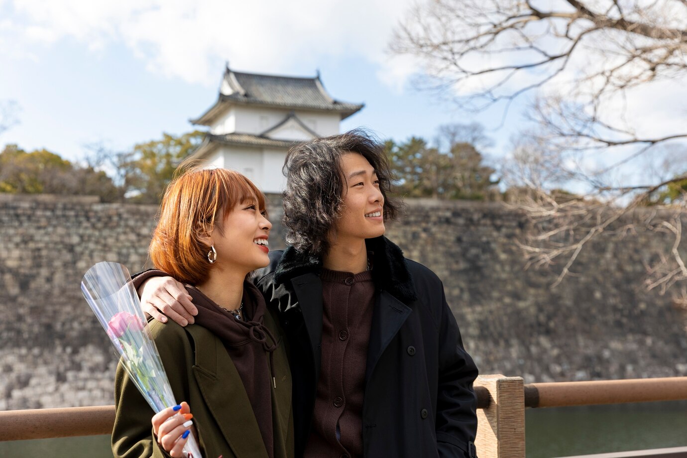 Cute japanese couple out on a date with rose flower