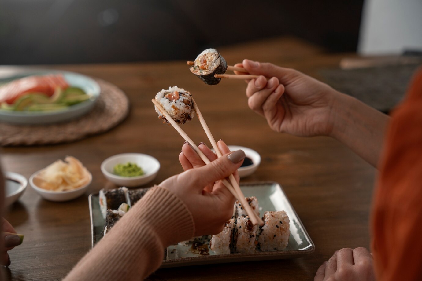 High angle women learning to make sushi