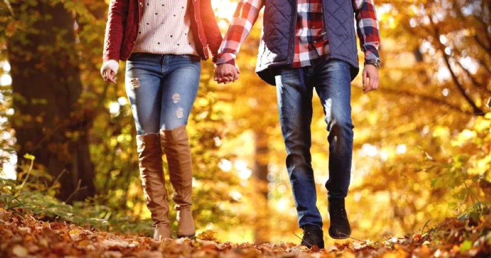 couple having dinner with autumn view 